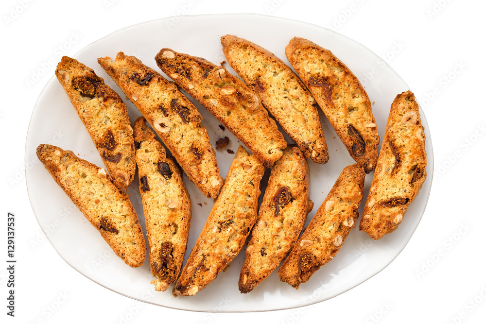 Classic Italian biscotti cookies on plate isolated a white backg Classic Italian biscotti cookies on plate isolated a white backg