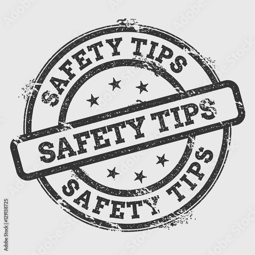 Safety tips rubber stamp isolated on white background. Grunge round seal with text, ink texture and splatter and blots, vector illustration.