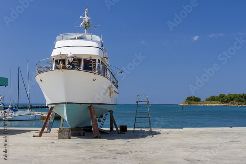 Repairing a boat on the sea shore
