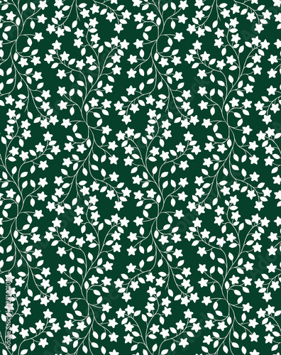 Seamless floral pattern. Repeating ivy pattern with flowers and leaves. White silhouettes on dark green background. Vector illustration.