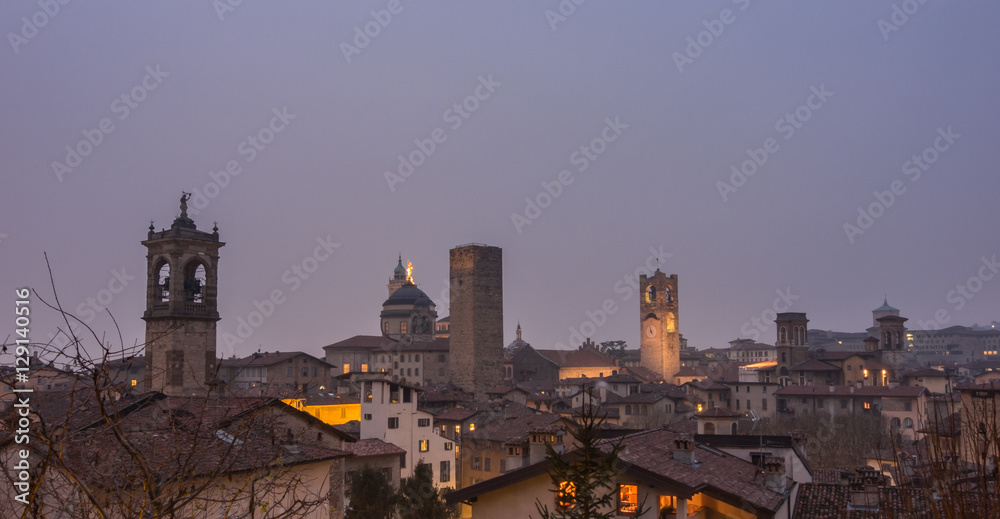 Bergamo - Old city (Citta Alta). One of the beautiful city in Italy. Lombardia. Evening landscape. The clock tower called Il Campanone (the big bell) and towers