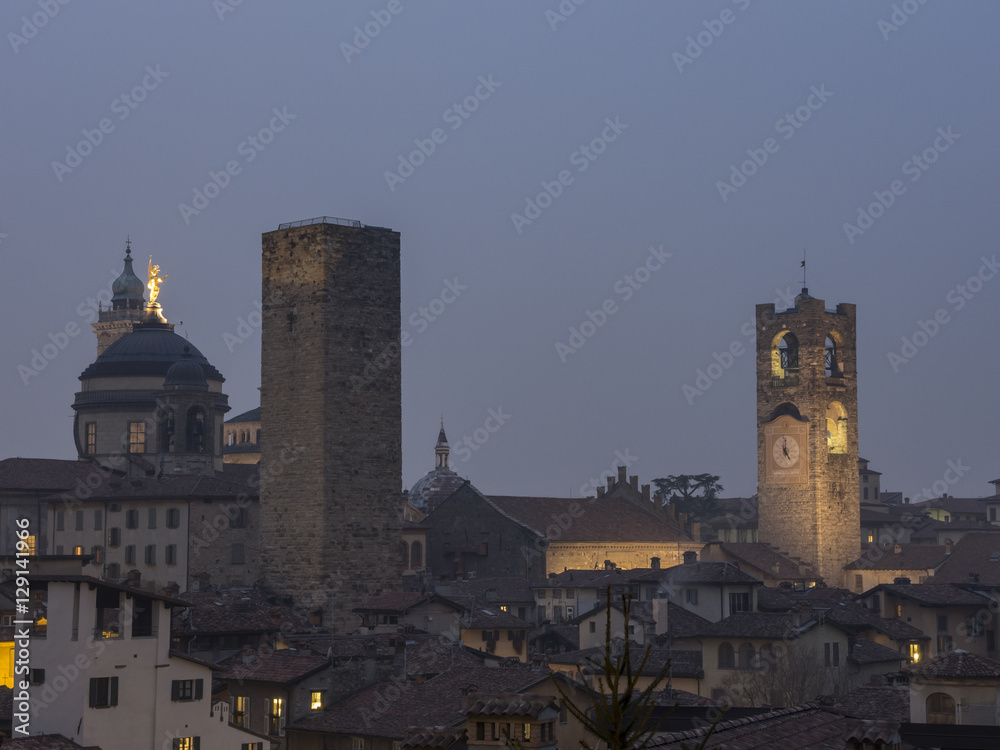 Bergamo - Old city (Citta Alta). One of the beautiful city in Italy. Lombardia. Evening landscape. The clock tower called Il Campanone (the big bell) and towers