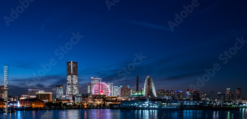 Wide panorama of Yokohama Minato Mirai 21 seaside urban area in Japan at dusk