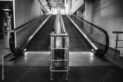 Empty escalator in black and white in store