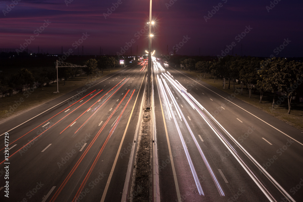Obraz premium Speed Traffic at light trails on motorway highway at night,backg