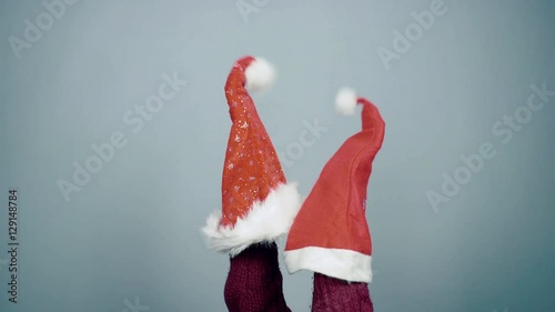 Young man showing a puppet show using a Santa hat Christmas preparation photo