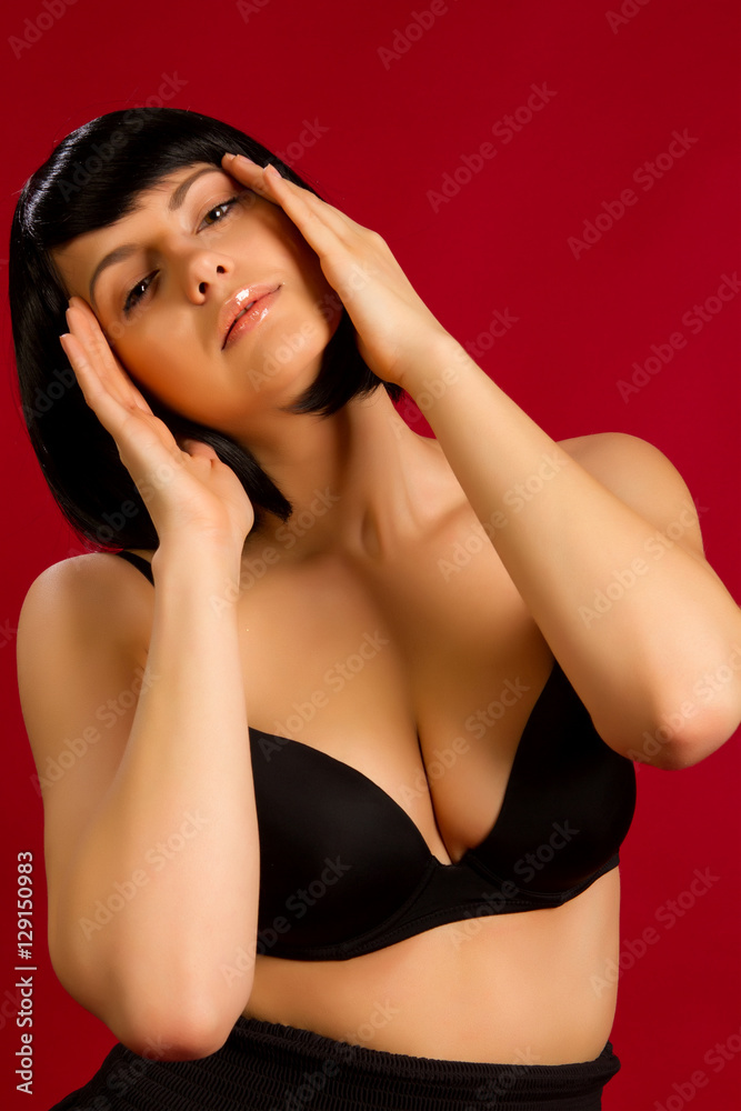 brunette on red background in studio brunette on red background in studio