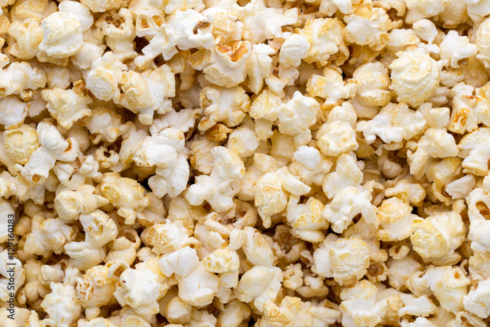 Popcorn background. Caramel sweet corn. Cinema snack. Popcorn background. Caramel sweet corn. Cinema snack.