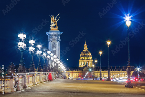 Alexandre III Bridge, Paris France. Night scene of cityscape with lights.