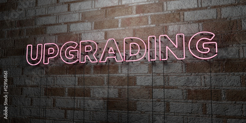 UPGRADING - Glowing Neon Sign on stonework wall - 3D rendered royalty free stock illustration.  Can be used for online banner ads and direct mailers..