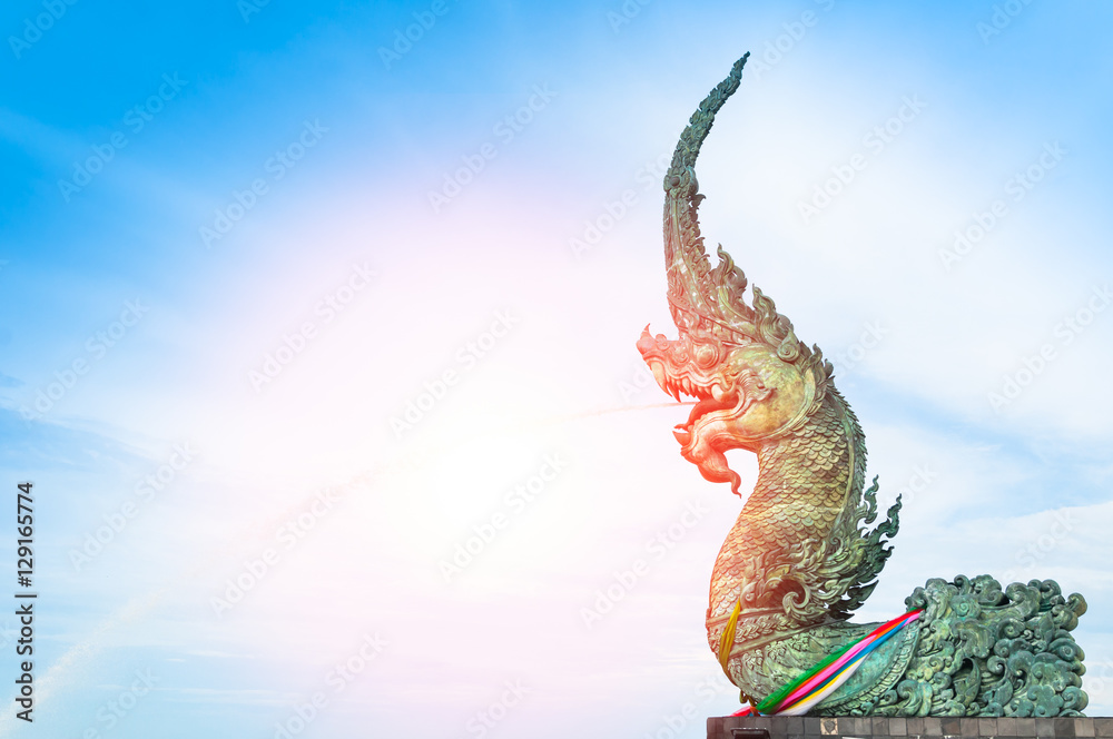 Naga statue spray water to the sea with blue sky background,samila