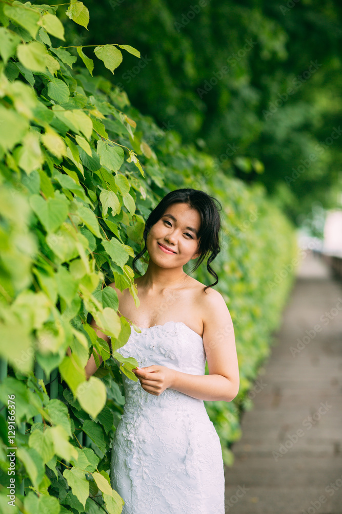 Portrait of chinese bride in green leaves Portrait of chinese bride in green leaves