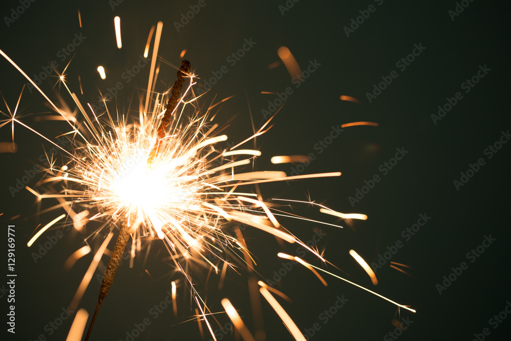 Fototapeta premium Christmas sparkler on black background