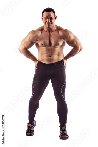 Sexy athletic man showing muscular body, isolated over white background.
