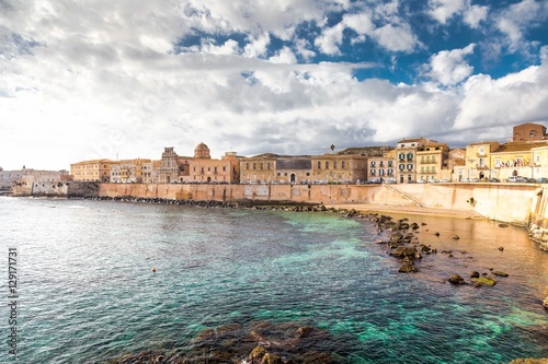 Ionian coast of Ortigia island, a part of Siracusa. Travel photo for a postcard. Sicily, Italy, Europe. photo