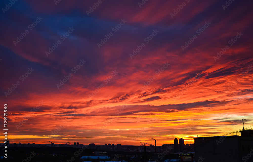 orange blue sky at sunset over the city