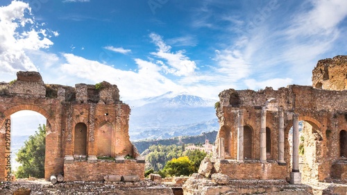 Ruins and columns of antique greek theater in Taormina and Etna Mount in the background. Sicily, Italy, Europe. © rois010