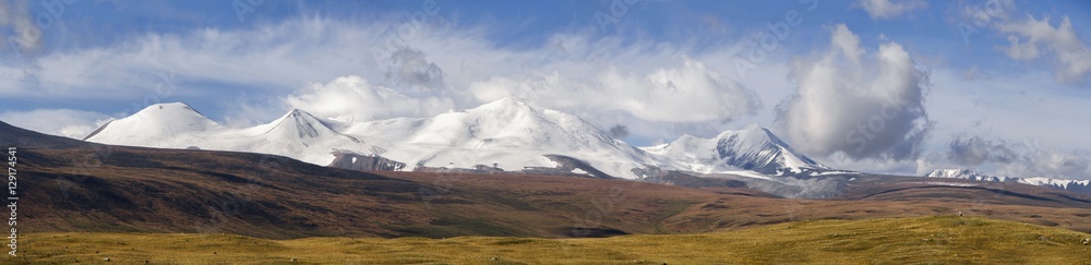 Altai, Ukok plateau. Beautiful sunset with mountains in the background. Snowy peaks autumn. Journey through Russia, Altay