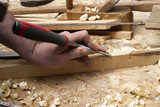 carpenter working,hammer,meter and screw-driver on construction