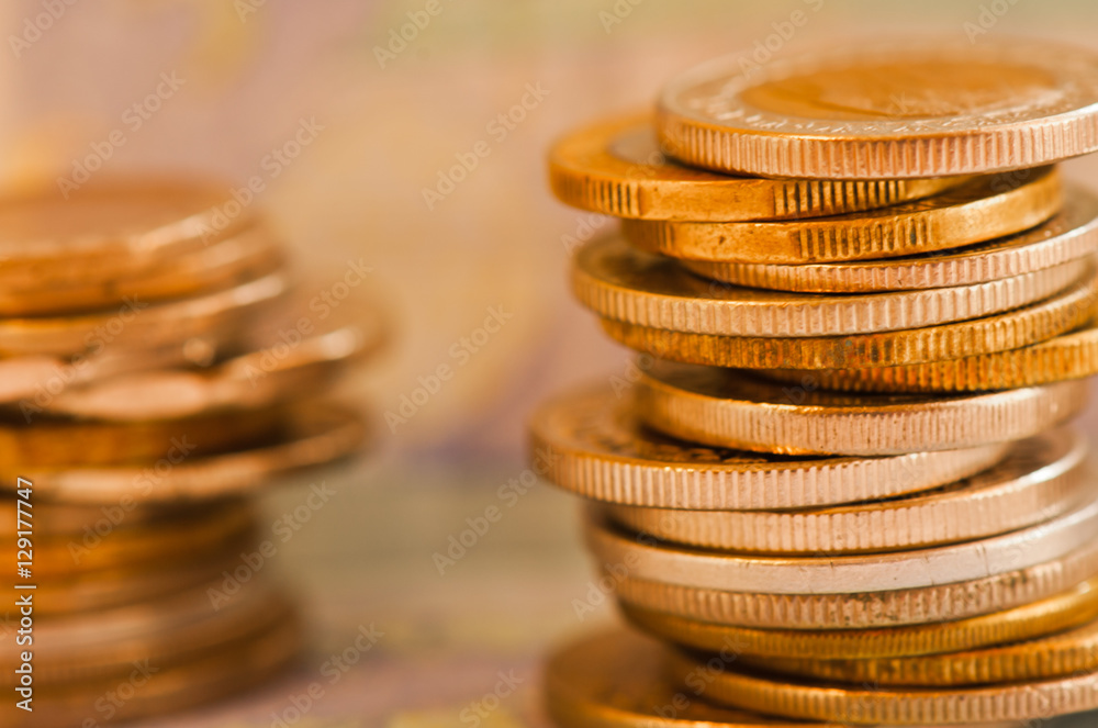 coins of different countries against euro banknote background coins of different countries against euro banknote background