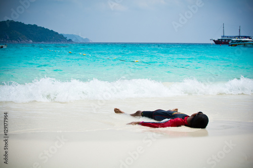 laying down on beach