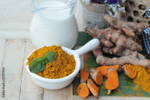 Turmeric powder with honey and milk for scrub.
