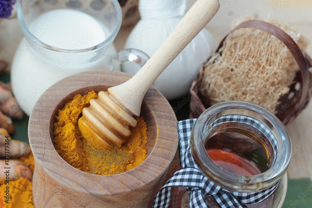 Turmeric powder with honey and milk for scrub. Turmeric powder with honey and milk for scrub.