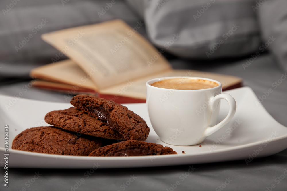 Morning coffee with chocolate cookies in bed Morning coffee with chocolate cookies in bed