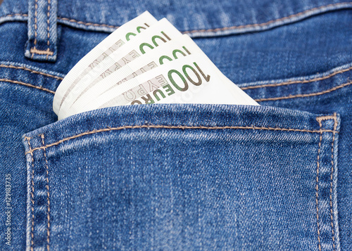 euro money in blue jeans pocket background