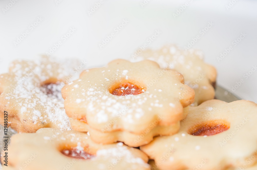 Homemade apricot jam Linzer with icing sugar close up Homemade apricot jam Linzer with icing sugar close up