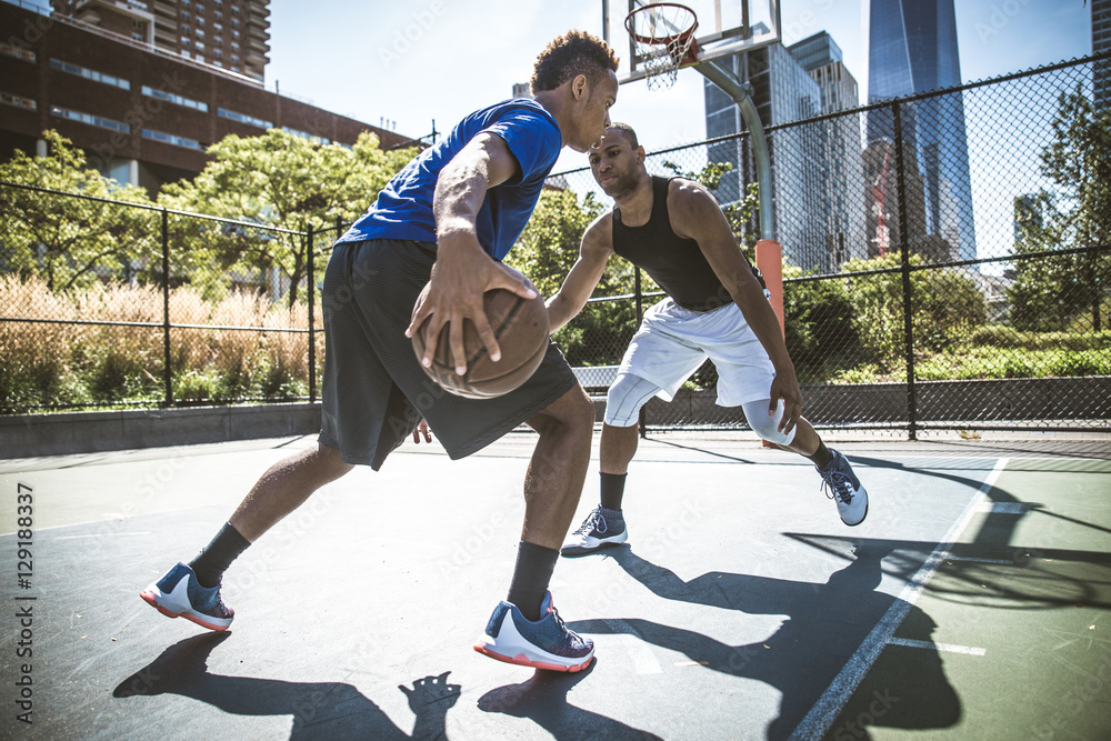 Fototapeta premium Basketball player playing outdoors