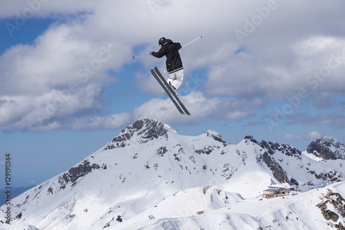 Skier jump on mountains. Extreme sport.