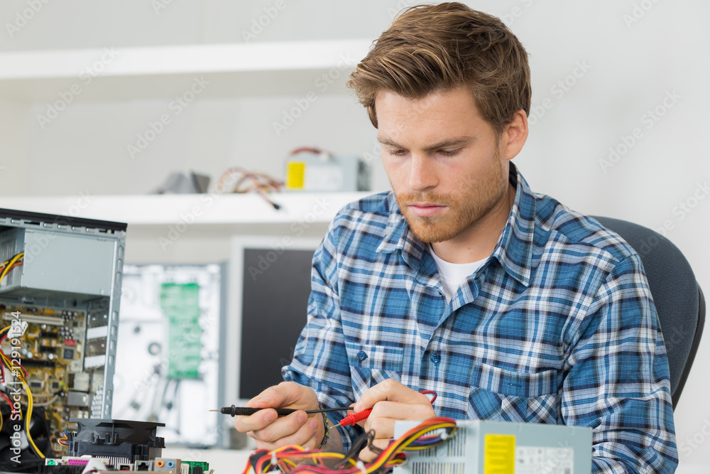 repairman fixing electronic devices repairman fixing electronic devices