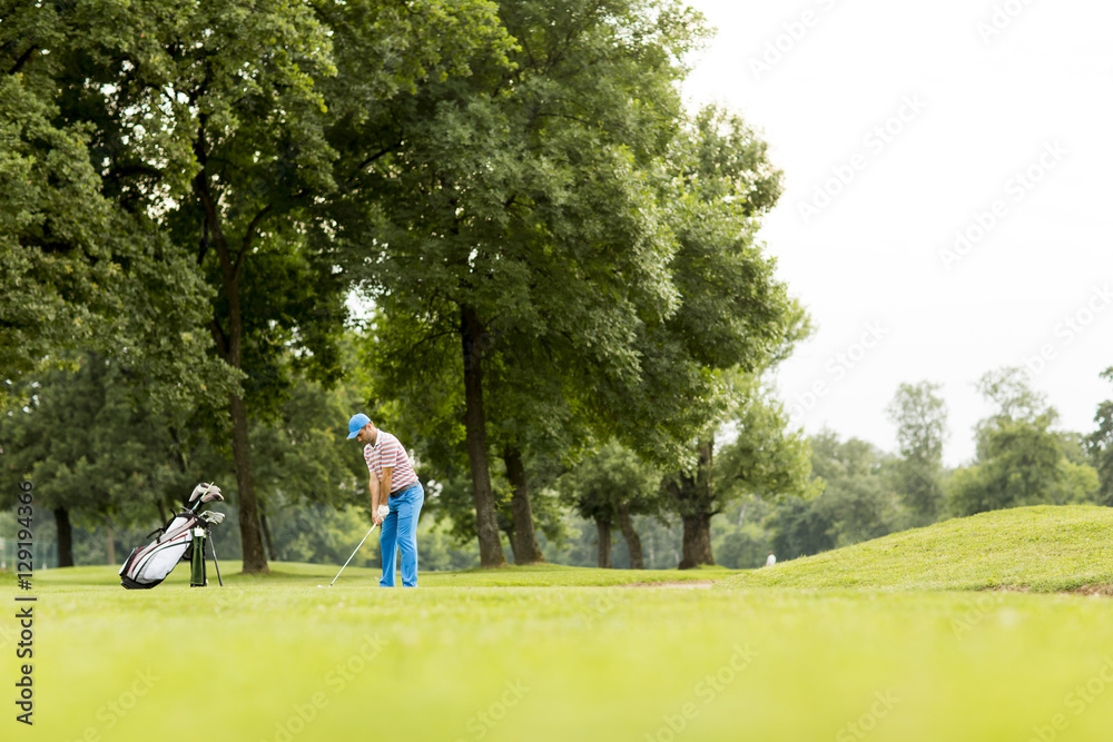 Golfer playing on beautiful golf course Golfer playing on beautiful golf course