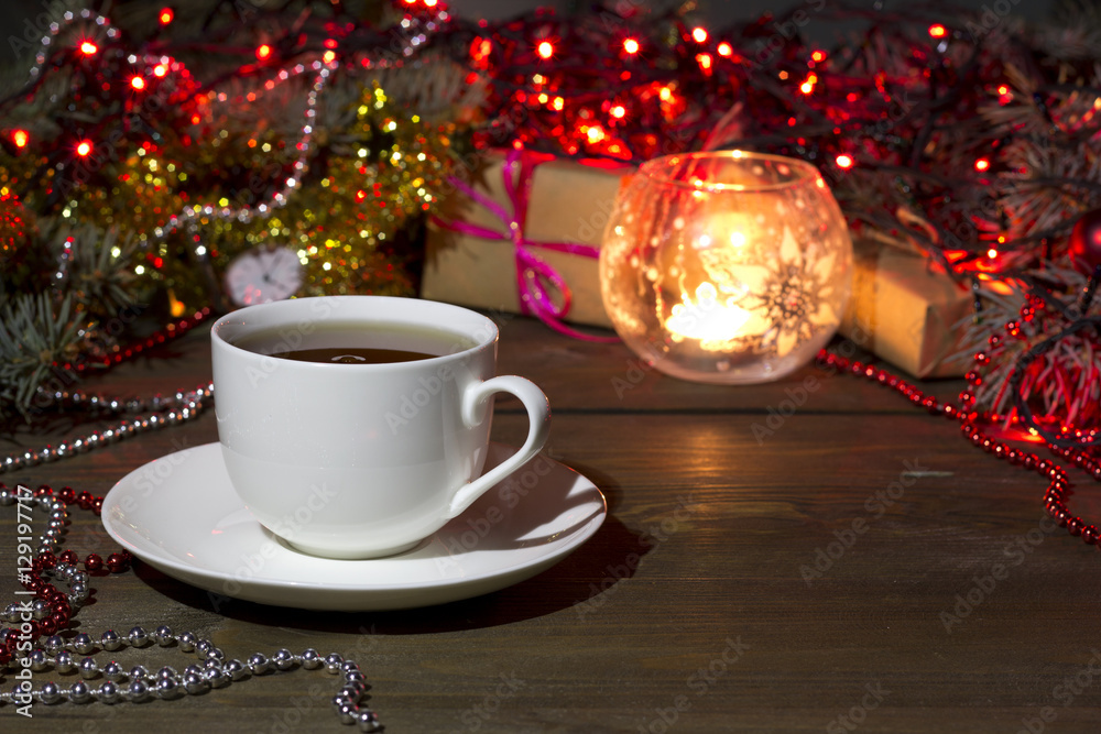 Fototapeta premium cup of tea on a background Christmas toys