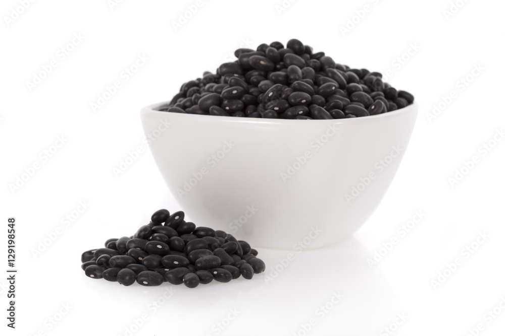 Black turtle beans in a bowl isolated on white background Black turtle beans in a bowl isolated on white background