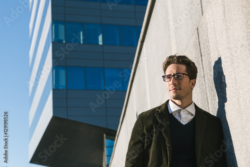 Young handsome man posing in an urban context