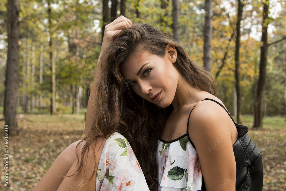Beautiful girl in dress in autumn forest