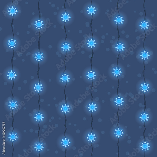 Christmas and New Year garland seamless pattern, background. Blue snowflake led lights garland with wires on blue background with snow.
