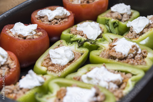 Peppers and tomatoes stuffed with meat