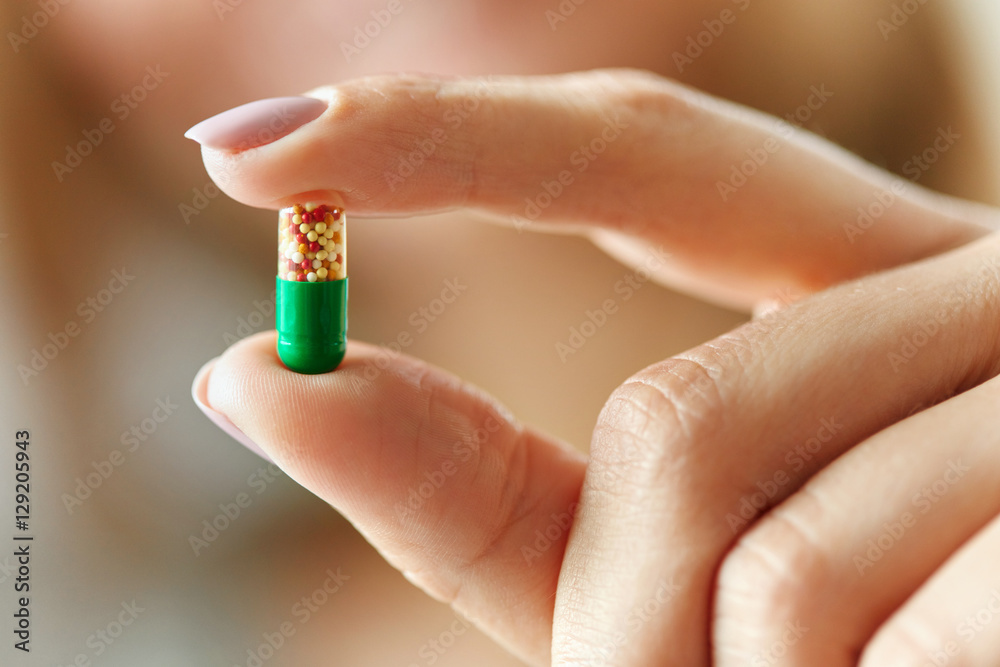 Medicine. Female Hand Holding Colorful Pill, Tablet Medicine. Female Hand Holding Colorful Pill, Tablet