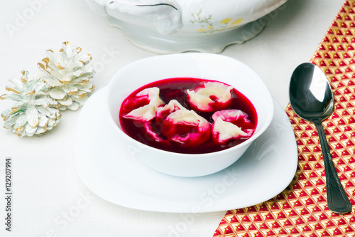Red borsch with dumplings, traditional Polish Christmas Eve dish photo