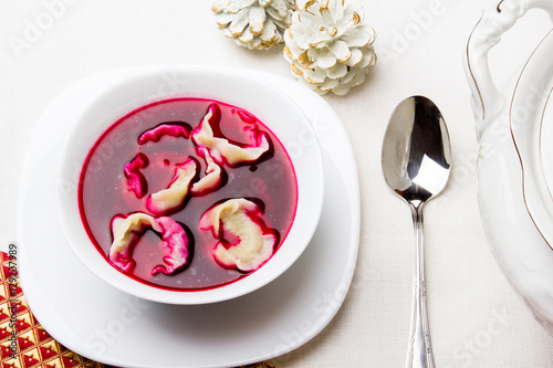 Red borsch with dumplings, traditional Polish Christmas Eve dish photo