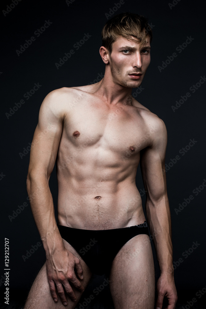 handsome young man in underwear posing in studio handsome young man in underwear posing in studio