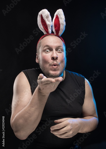 Comic actor with bunny ears, on the eve of Christmas and New Year photo