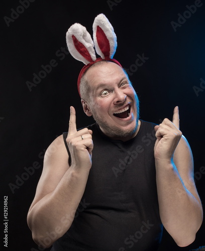 Comic actor with bunny ears, on the eve of Christmas and New Year photo