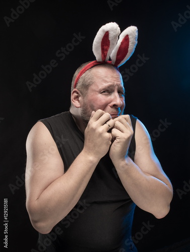 Comic actor with bunny ears, on the eve of Christmas and New Year photo