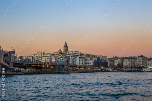 Sunset view of Galata tower and Galata bridge over the Bosphorus channel  Istanbul  Turkey