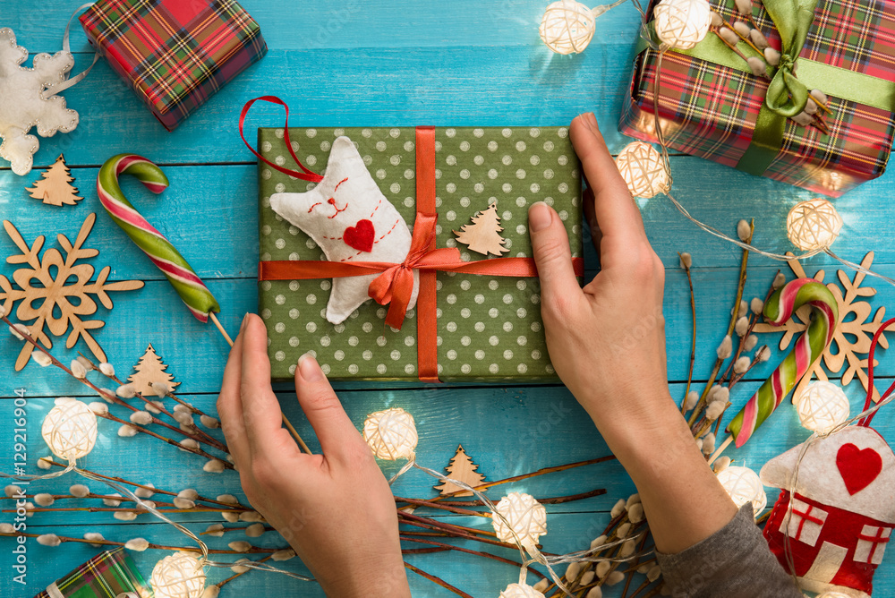 Obraz premium Christmas Hand made gift box toy on blue wooden background