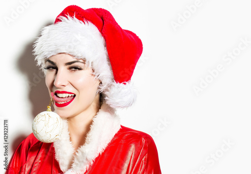 Flirting girl with Christmas bauble